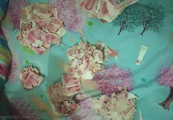 كودك چيني ميليون ها دلار اسكناس را پاره كرد