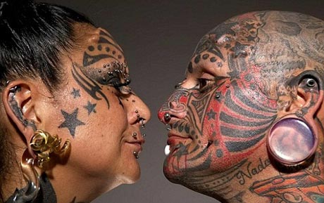 اقدام عجیب یک زوج با خالکوبی روی بدن (+عکس)